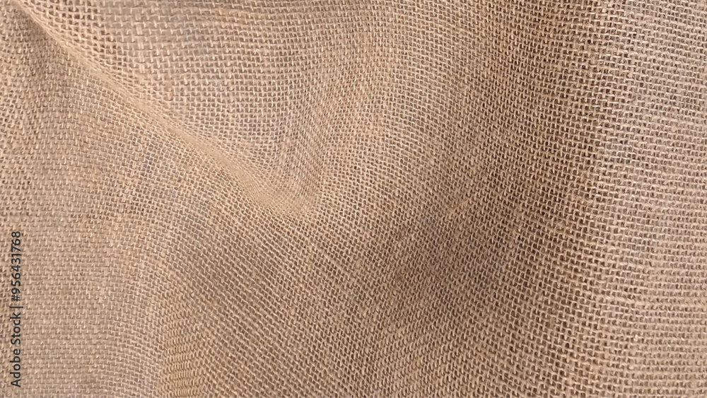 Brown rough linen fabric texture close-up as background. Detailed close-up of natural burlap fabric texture with woven pattern. Brown rough linen fabric texture close-up as background. Detailed close-up of natural burlap fabric texture with woven pattern.