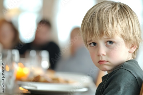 He looks worried with his parents fighting behind him