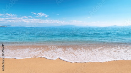 a calm beach with gentle waves lapping at the shore, evoking a sense of relaxation and tranquility