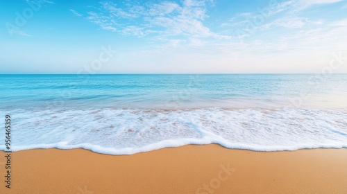 a calm beach with gentle waves lapping at the shore, evoking a sense of relaxation and tranquility