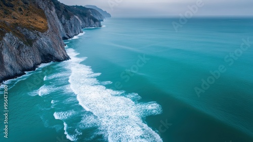 a dramatic cliffside view with waves crashing below, capturing the power and beauty of nature