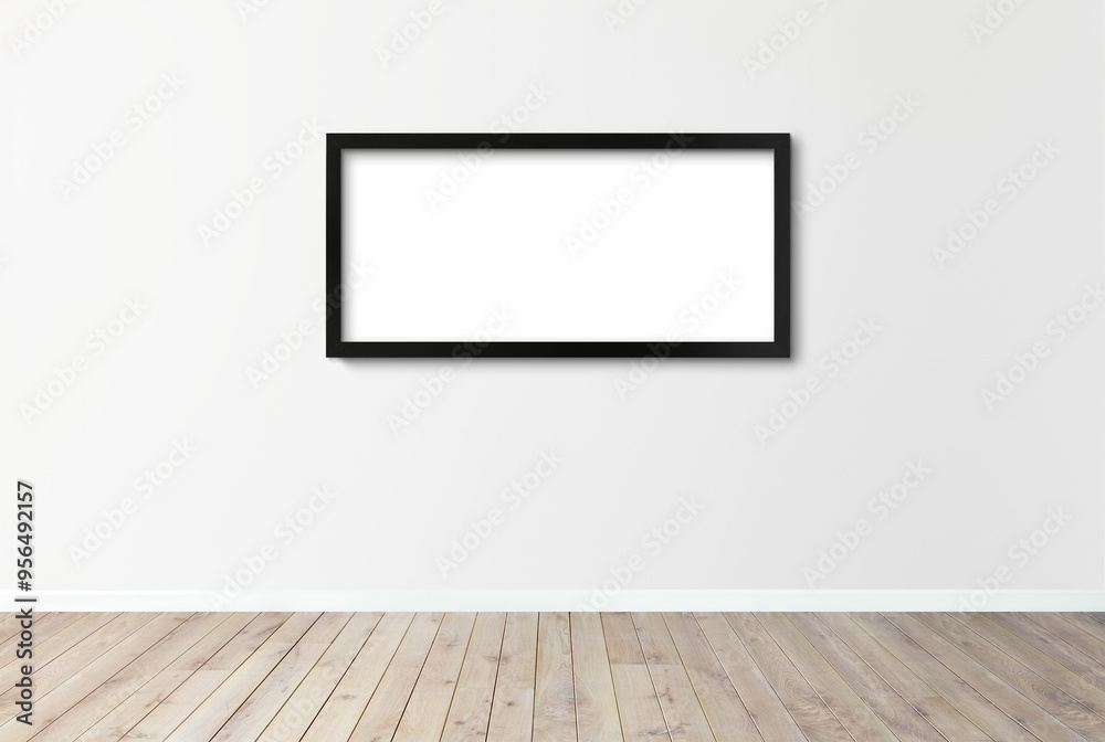 Black picture frame mockup hanging on an off white wall Black picture frame mockup hanging on an off white wall