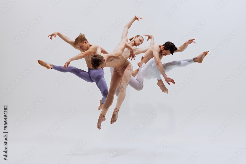 Dancers in mid-air, exercising control and precision, their leaps creating beautiful visual rhythm. against white studio background. Concept of music and dance, modern and classical art, movement. Dancers in mid-air, exercising control and precision, their leaps creating beautiful visual rhythm. against white studio background. Concept of music and dance, modern and classical art, movement.