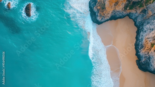 an aerial shot of a hidden beach surrounded by cliffs, with waves crashing against the rocks and seagulls flying overhead, capturing the untouched beauty of nature
