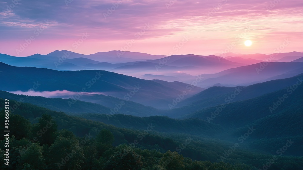 A beautiful sunrise over a mountain range with a pink sky. A beautiful sunrise over a mountain range with a pink sky.