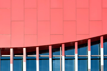 Red aluminium composite tiles decoration on glass wall of modern building, Geometric exterior architecture background design