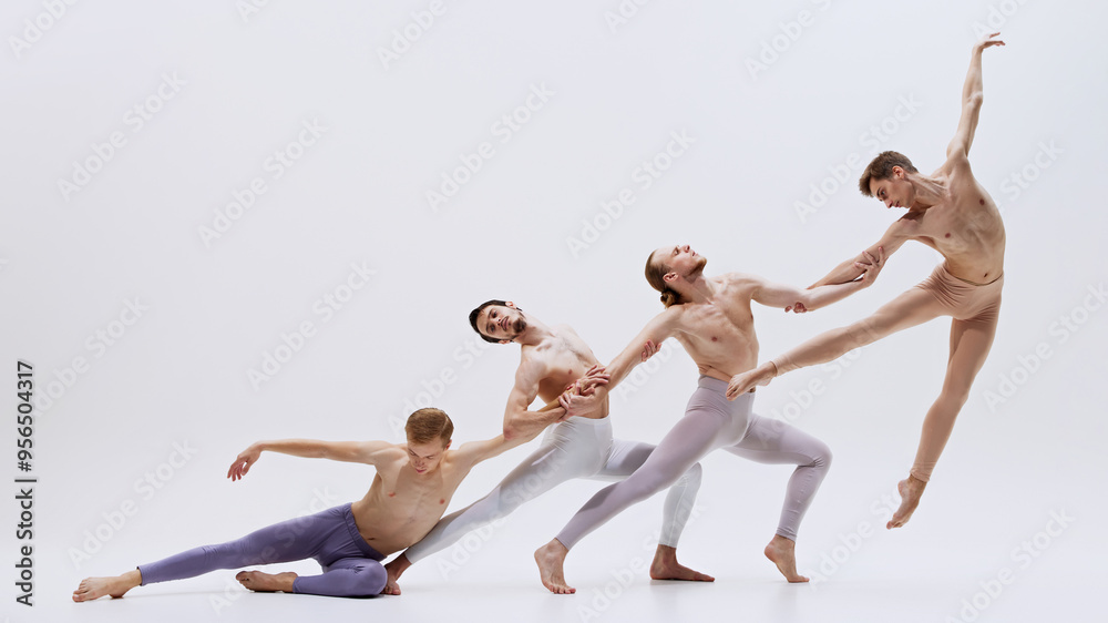 Obraz premium Dancers execute smooth transition from grounded to elevated poses, their movements capturing essence of both agility and grace. Concept of music and dance, modern and classical art.