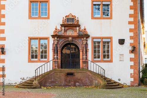 historic building from 1603 with decorated stairs to entrance door and sandstone architecture in Mainz, Germany photo