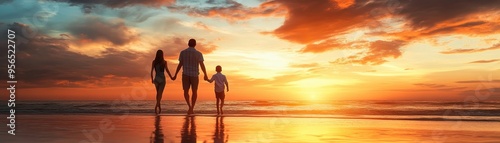 Family Walking on Beach at Sunset Holding Hands with Beautiful Sky and Ocean in Background