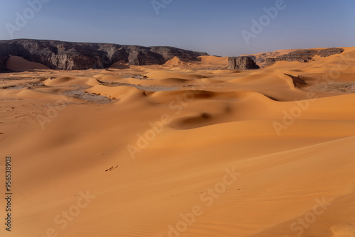 Sahara desert, sand, dunes and rocks in Algeria. Surrounding of Djanet. Place of Sahara named Moul Ennaga photo