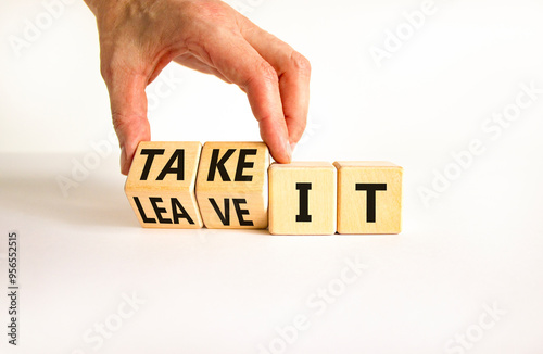 Take or leave it symbol. Businessman turns beautiful wooden cubes and changes words Leave it to Take it. Beautiful white table white background. Copy space. Business and take or leave it concept.