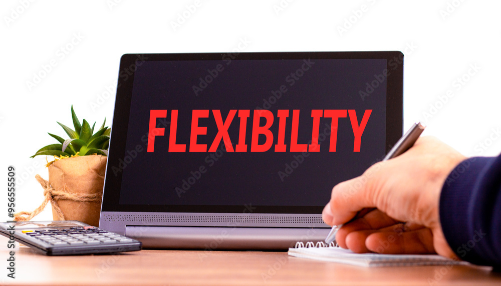 Flexibility symbol. Concept word Flexibility on beautiful black tablet. Beautiful wooden table white background. Businessman hand with pen. Business flexibility concept. Copy space. Flexibility symbol. Concept word Flexibility on beautiful black tablet. Beautiful wooden table white background. Businessman hand with pen. Business flexibility concept. Copy space.