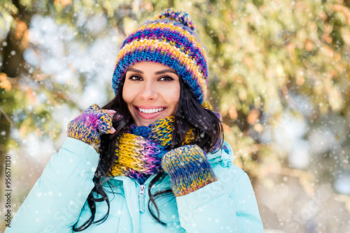 Photo of positive charming lady shiny white smile wear knitted mittens hat scarf coat in park outdoors