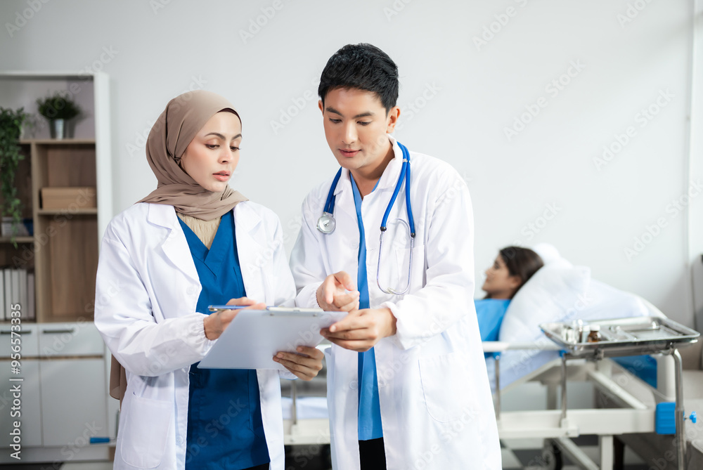 Hospital Ward. Doctor Talks With Professional Head Nurse or Surgeon, They Use Digital tablet Computer. Diverse Team of Health Care