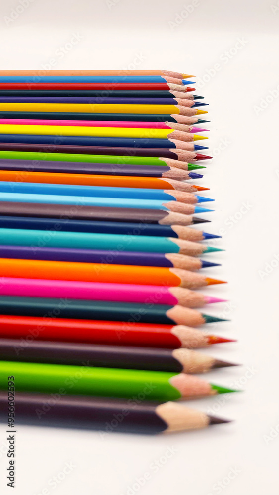 Colorful sharpened pencils are lined up on the table. Colorful sharpened pencils are lined up on the table.