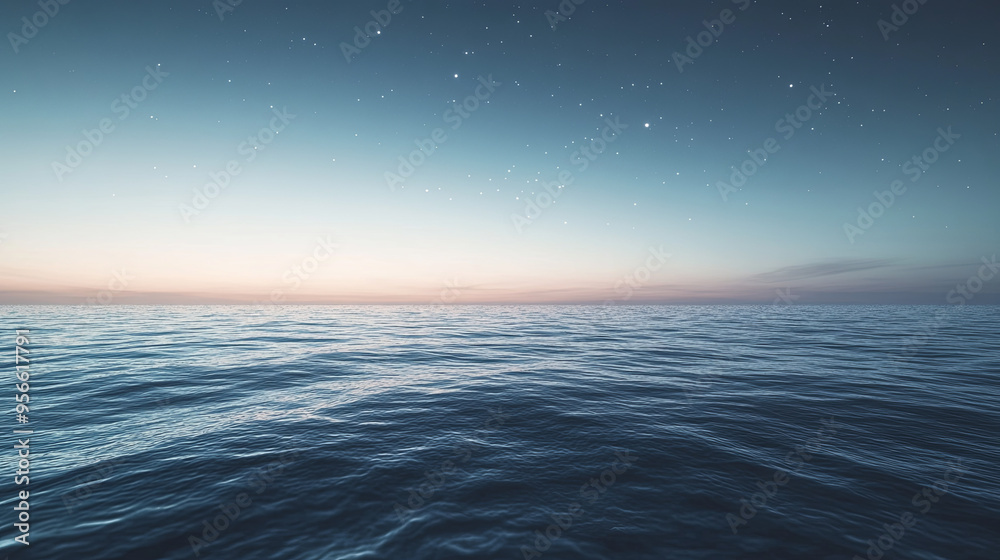 Obraz premium A serene twilight over the sea, with the sky transitioning from day to night, stars beginning to twinkle above the calm water.
