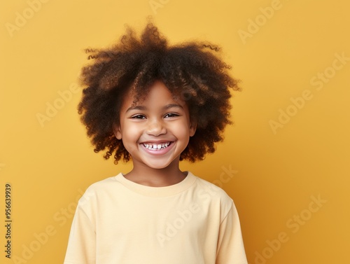 Ivory background Happy black american african child Portrait of young beautiful kid Isolated on Background ethnic diversity equality acceptance  photo