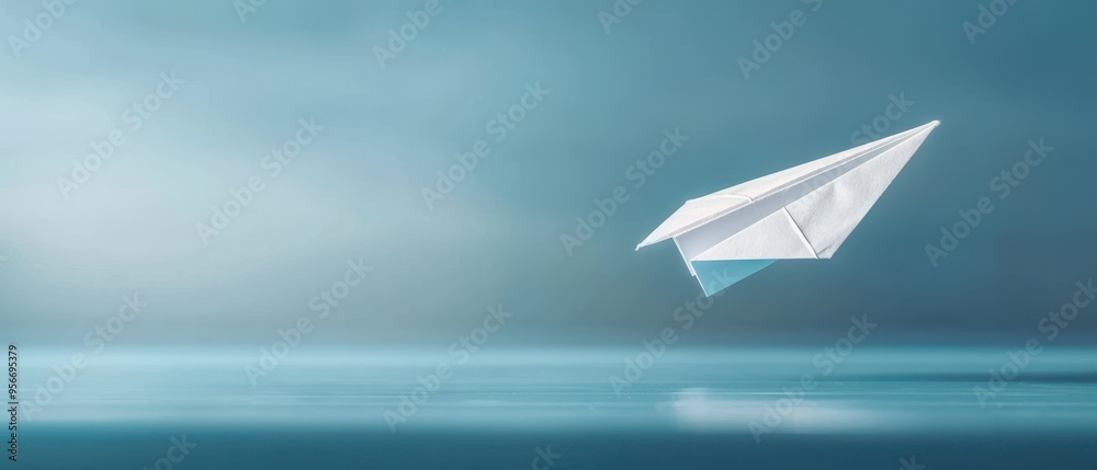 Floating paper airplane, capturing the essence of childhood imagination, simplicity and the joy of creativity against a tranquil blue background. Floating paper airplane, capturing the essence of childhood imagination, simplicity and the joy of creativity against a tranquil blue background.