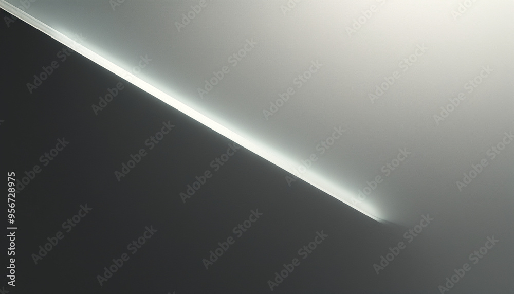 Minimalistic gray background with subtle silver rays of light, perfect for modern tech concept. Abstract, blurred image. Minimalistic gray background with subtle silver rays of light, perfect for modern tech concept. Abstract, blurred image.
