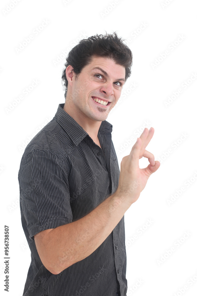 portrait of a young overconfident man showing ok hand gesture with evil smile on white background portrait of a young overconfident man showing ok hand gesture with evil smile on white background