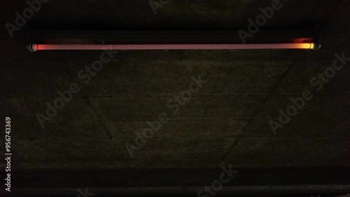 Flickering neon tube in garage with scary malfunction and dysfunction of neon lights flickers glowing and alarming or threatening in halloween atmosphere dramatic darkness gaslight with error switch