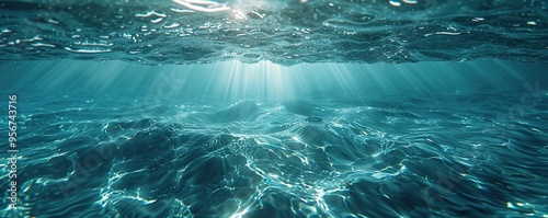 Underwater View of Sunbeams Illuminating Rippling Ocean Water