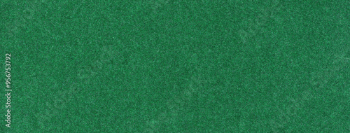 Texture dark green background from felt textile material, macro. Structure vintage emerald fabric cloth