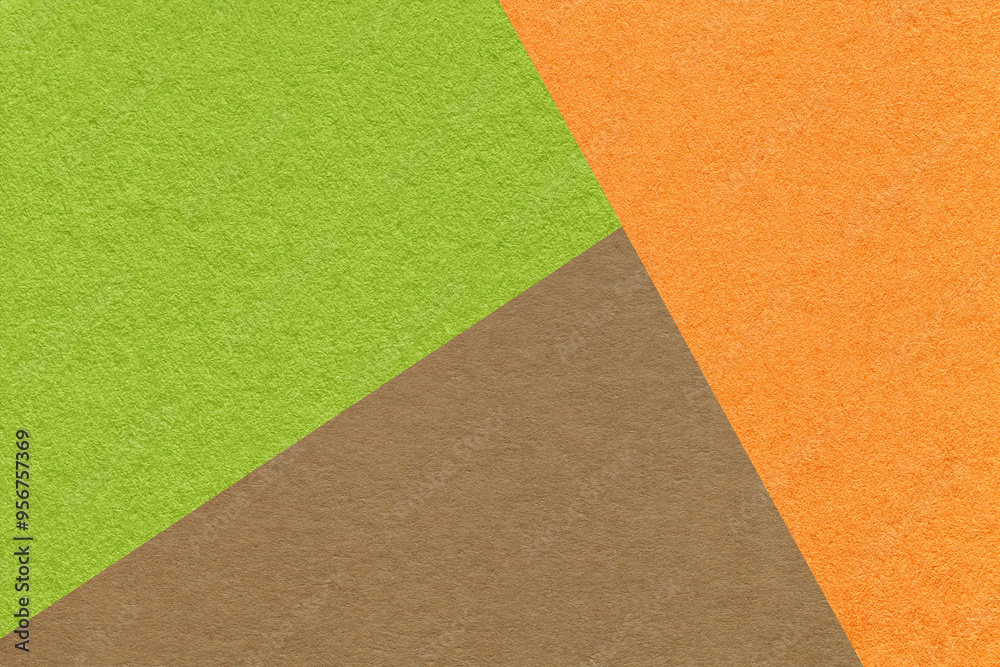 Texture of craft green, orange and brown shade color paper background, macro. Vintage abstract cardboard Texture of craft green, orange and brown shade color paper background, macro. Vintage abstract cardboard