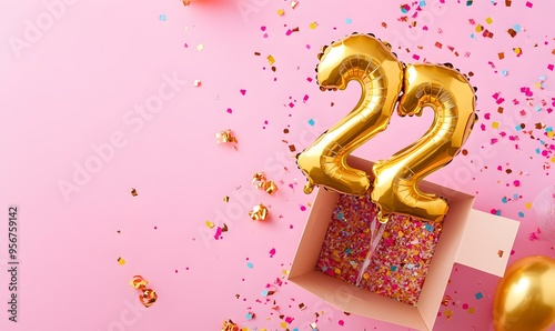 Happy birthday 22th with golden balloons and gift box on a pink background photo