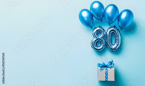 Happy birthday 80th with blue foil balloons and gift box on color background