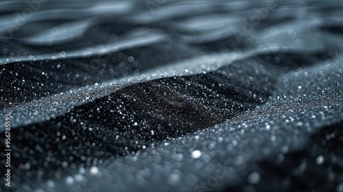 Close-up of Glittering Black Sand Dunes with Bokeh Effect photo