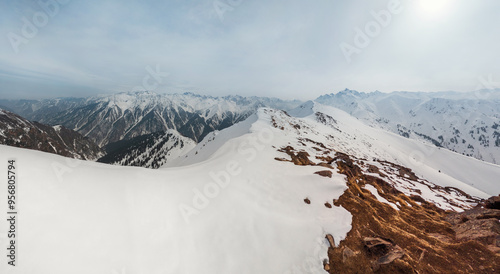 Scenic beautiful tranquil view of winter Tien Shan mountain ranges from Bukreev Peak in the mountains of Central Asia, Kazakhstan - Almaty national nature park. photo