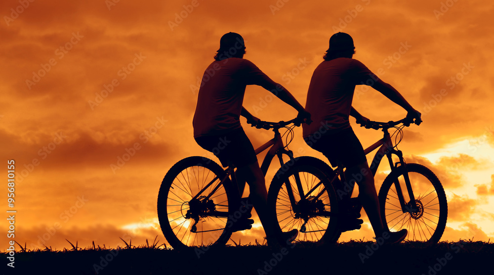Obraz premium 2 two male silhouette of Mountain biker looking at the sunset. couple of mens rides on mountain, hill bike trail. pair of guys on mountain bike adventure against sunset sky. unrecognizable persons.