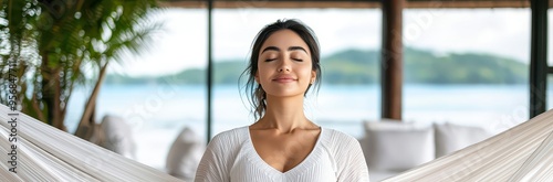 A serene woman enjoys relaxation in a cozy setting, surrounded by nature and tranquility, embodying peace and mindfulness. Free Download A serene woman enjoys relaxation in a cozy setting, surrounded by nature and tranquility, embodying peace and mindfulness. - GFXLoad