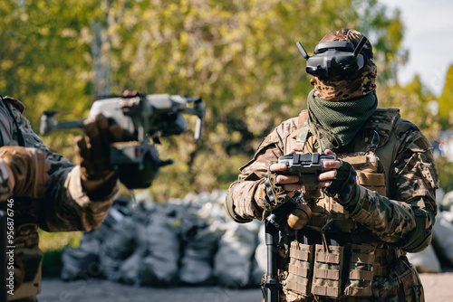 Concept modern war with technology UAV robots. Army operator in FPV glasses launches drone with bomb to drop to enemy