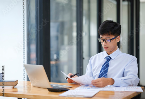 Businessman Analyzing Risk, Investment, and Market Data in the Office