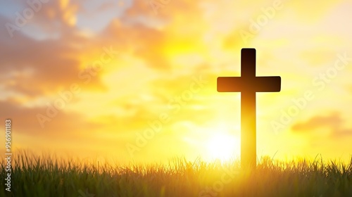 Silhouette christian cross on grass in sunrise background 