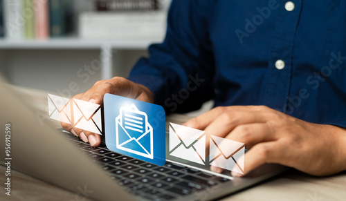 New email notification alerts concept for Digital marketing business communication through virtual inbox and internet technology as Business people use laptop with emails on a virtual screen