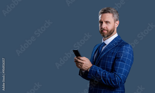 Hispanic business man with phone. Businessman using phone. Man phone conversation isolated on grey. Businessman chatting. Businessman texting and messaging. Social network. Copy space banner