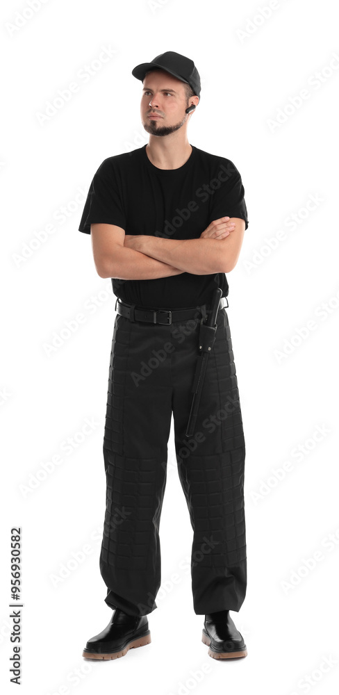 Young bodyguard with baton and earpiece isolated on white Young bodyguard with baton and earpiece isolated on white
