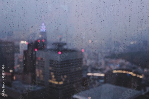 Views of Tokyo Skyline at Dusk Through a Rainy Window, Droplets Visible, City out of Focus