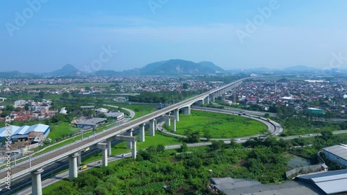 Established Aerial View of Pasir Koja Interchange, the meeting point of Soroja Toll Road, Purbaleunyi Toll Road and Jakarta-Bandung High Speed ​​Rail Line, Bandung, Indonesia photo