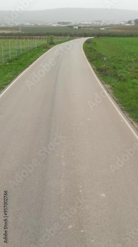 Wallpaper Mural fast drone shot over empty road in spain countryside fields agriculture driving car local regional street Torontodigital.ca