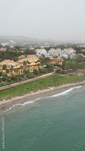 apartment properties real estate coastline seaside sea water blue waves forward aerial millionairs marbella spain luxury resorts  photo