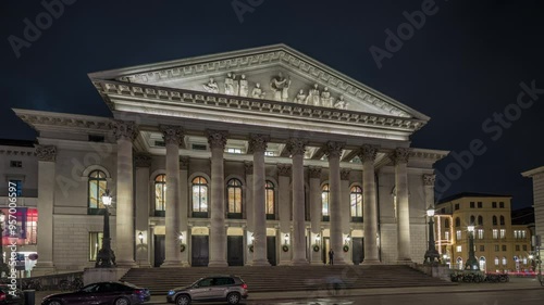 Munich National Theatre or Nationaltheater on the Max Joseph square night timelapse hyperlapse. Illuminated historic opera house front view, home of the Bavarian State Opera. Germany photo