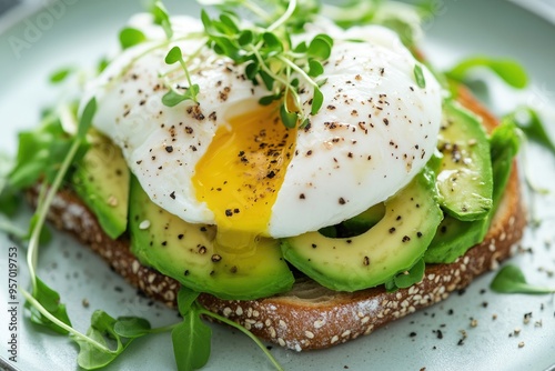 Poached Egg on Avocado Toast with Microgreens and Pepper