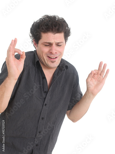 Принти на полотні Young  man having satisfied y look, smiling, gesturing, showing OK sign with both hands