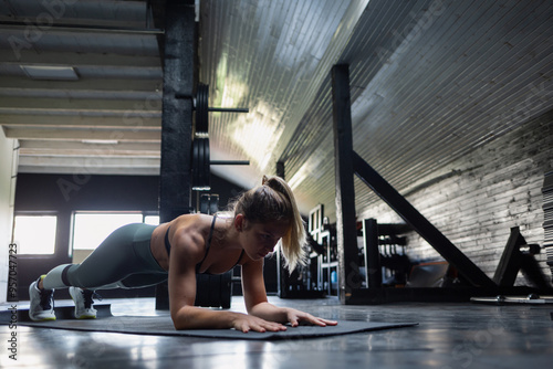 Female practising in a gym photo