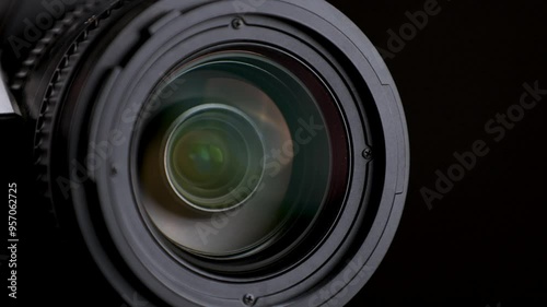 Close-up view of a professional camera lens with smooth manual adjustment.