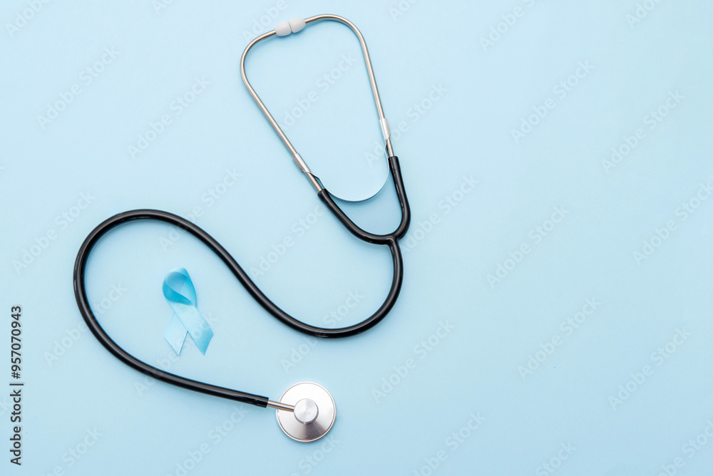 Prostate Cancer Awareness with Blue Ribbon and Stethoscope on Blue Background, Medical Diagnostic Concept Prostate Cancer Awareness with Blue Ribbon and Stethoscope on Blue Background, Medical Diagnostic Concept